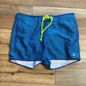 Original Penguin swim trunks with a pattern of small, dark blue dots